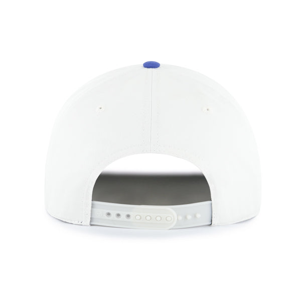 Back: White hat with white snapback straps, blue crown