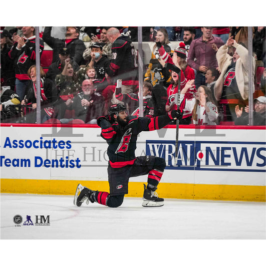 Photo of Jalen Chatfield hitting his signature celebration at a home game