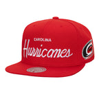 Front: Red flatbrim hat, "CAROLINA Hurricanes" in white across front, "Hurricanes" in cursive