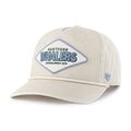 Front: Cream hat with rope on brim, diamond-shaped Blue/white patch on front