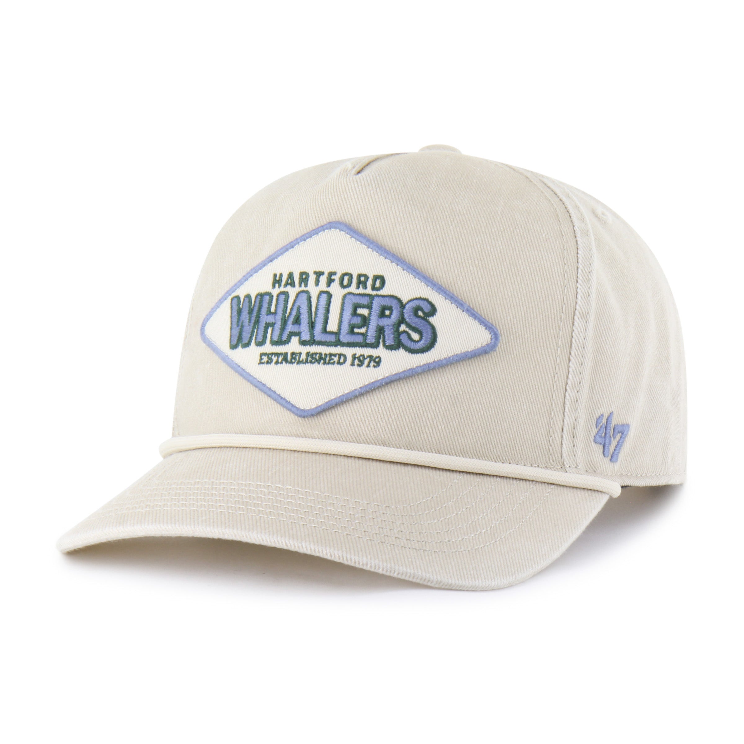 Front: Cream hat with rope on brim, diamond-shaped Blue/white patch on front