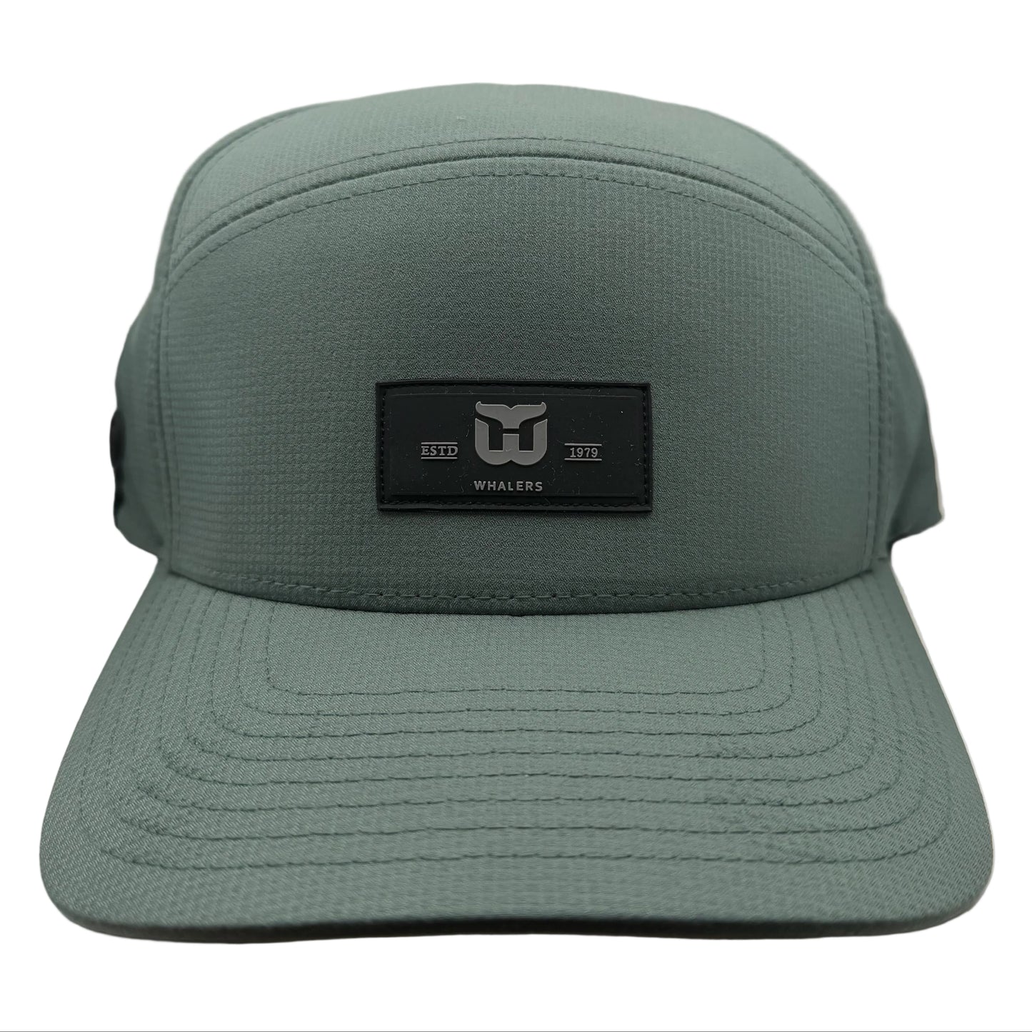 Green hat, black retangular patch on front with Whalers logo, "ESTD 1979"