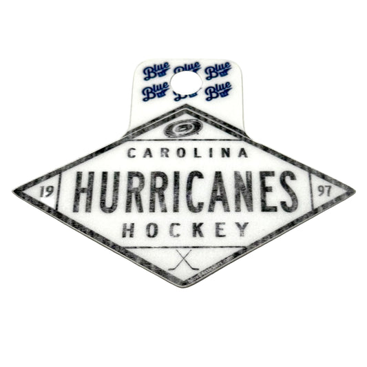 Rhombus-shaped sticker, "CAROLINA HURRICANES HOCKEY 1997" in black, white background