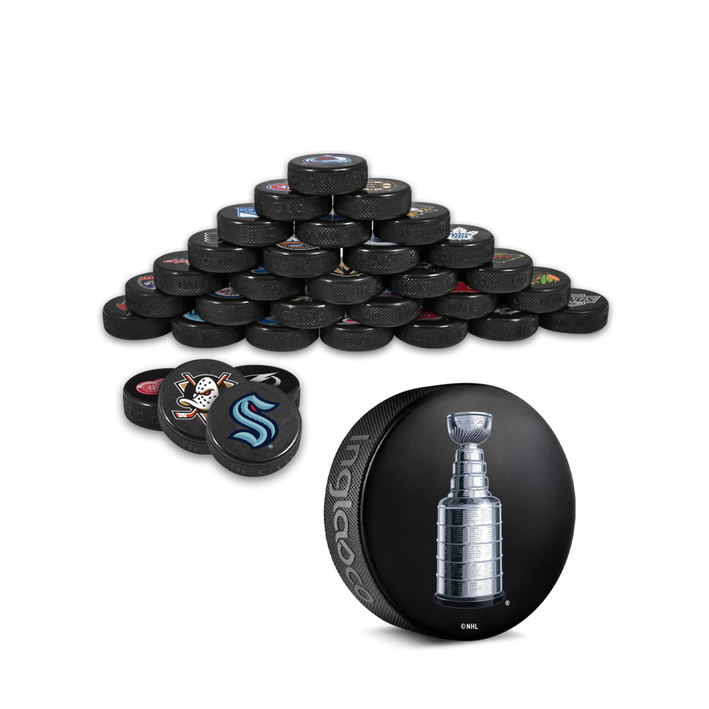 All 32 NHL team Pucks and Stanley Cup Puck that are included with the Plaque