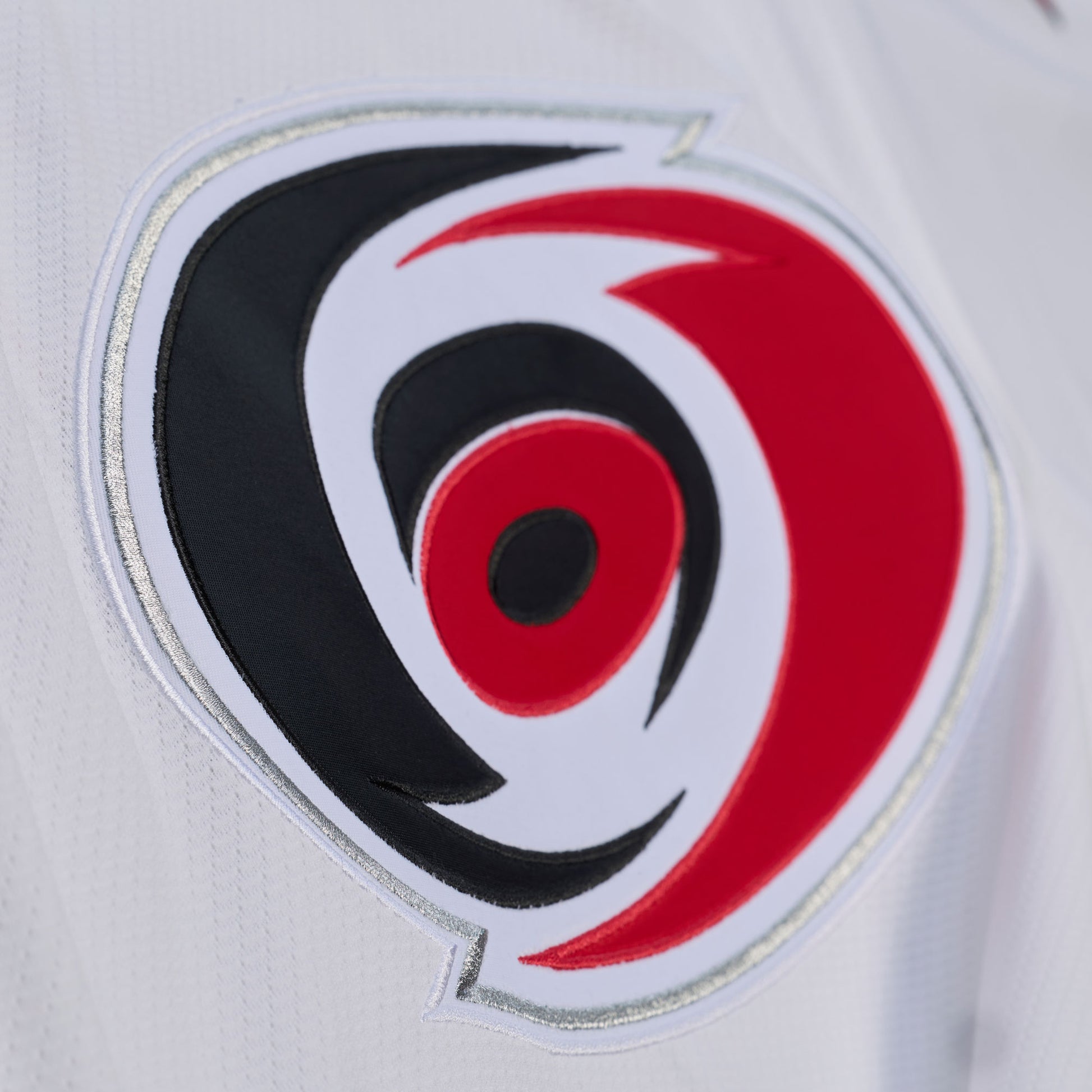 Close up of the Primary logo crest on the front