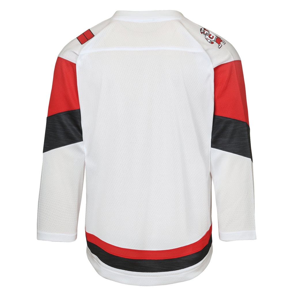 Back: White jersey, red/heather black trim, differing patches on shoulders
