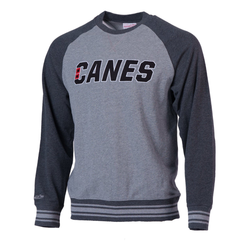 Light gray crewneck with dark gray sleeves, "CANES" wordmark across chest