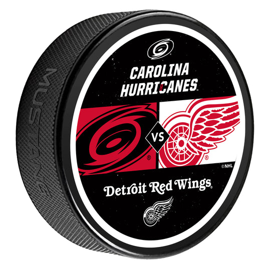 Matchup puck with Hurricanes Tonal logo 'vs' Red Wings Primary logo