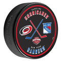 Matchup puck of Carolina Hurricanes and New York Rangers with red/blue cross-sticks