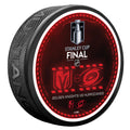 Hurricanes/Golden Knights Stanley Cup Final matchup puck featuring both team's logos in red