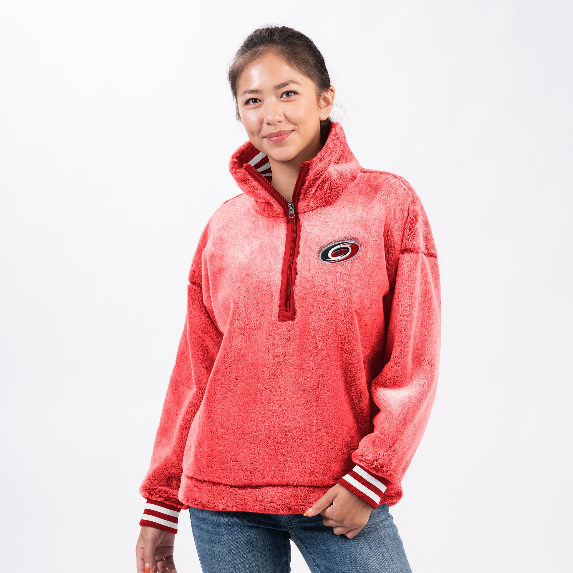Front: Fluffy red quarter zip with collar and Hurricanes logo on left chest