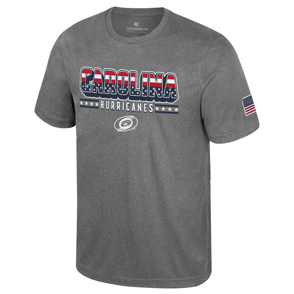 Front: Gray tee, "CAROLINA" in American flag pattern,  "Hurricanes" in white, whiteout Primary logo beneath