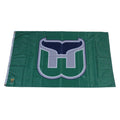 Green flag with Whalers tail logo on front, repeating Pucky pattern in background