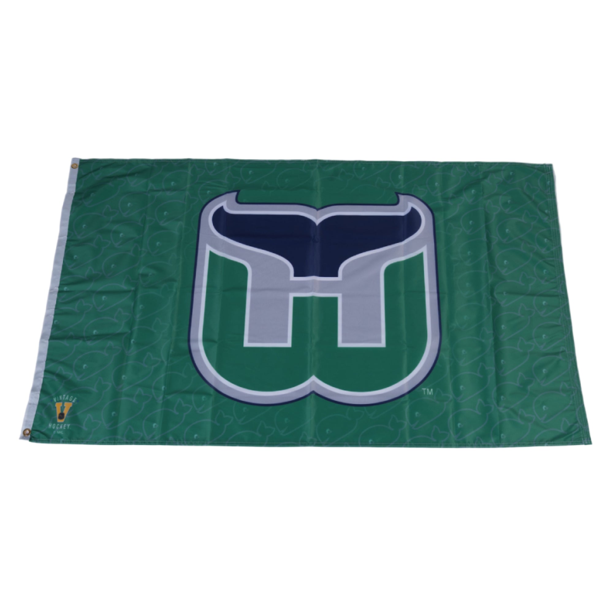 Green flag with Whalers tail logo on front, repeating Pucky pattern in background
