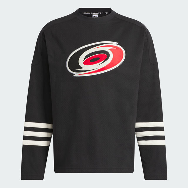 Front: Black sweater with 3 stripes on each arm and Hurricanes logo on chest