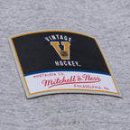 Close up of Vintage Hockey/Mitchell & Ness patch on front of shirt