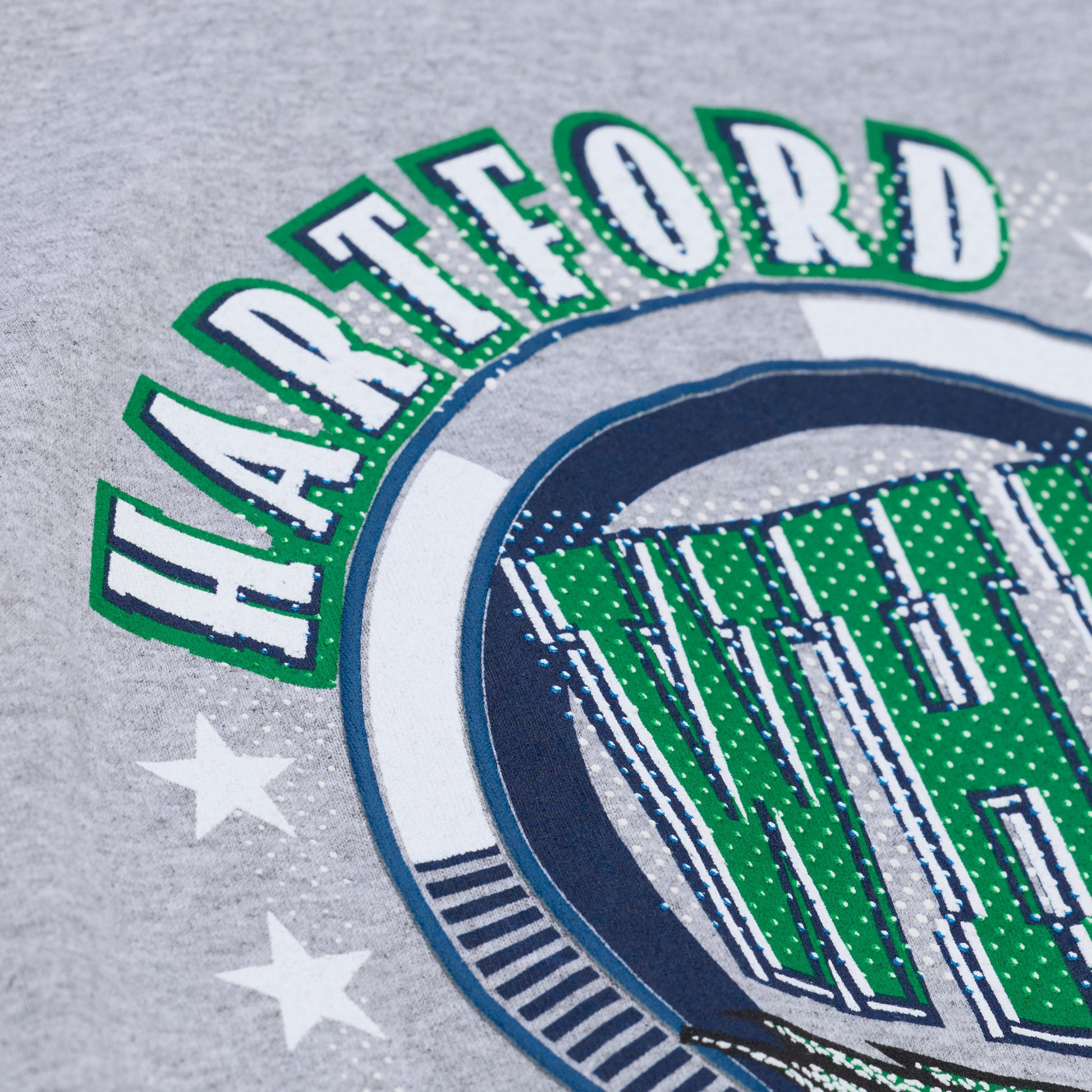 Close up of the "HARTFORD" on the graphic on front of tee
