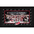 Black-framed Stanley Cup Champions photo with prints of player's autographs