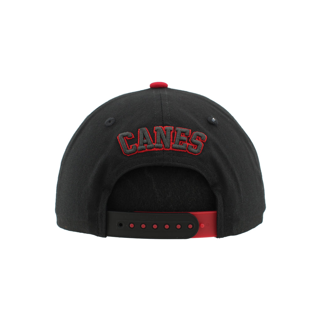 Back: Black/red snapback straps, "CANES" in black/red arched above straps