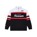 Front: Black quarter zip, red/white stripes, white shoulders, "Carolina Hurricanes" across chest