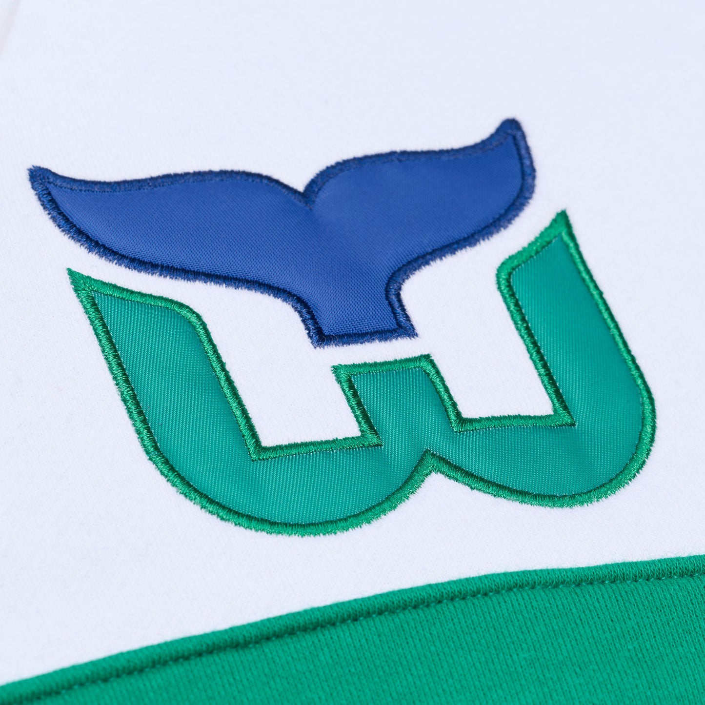 Close up of the Whalers Tail logo located on the upper left chest
