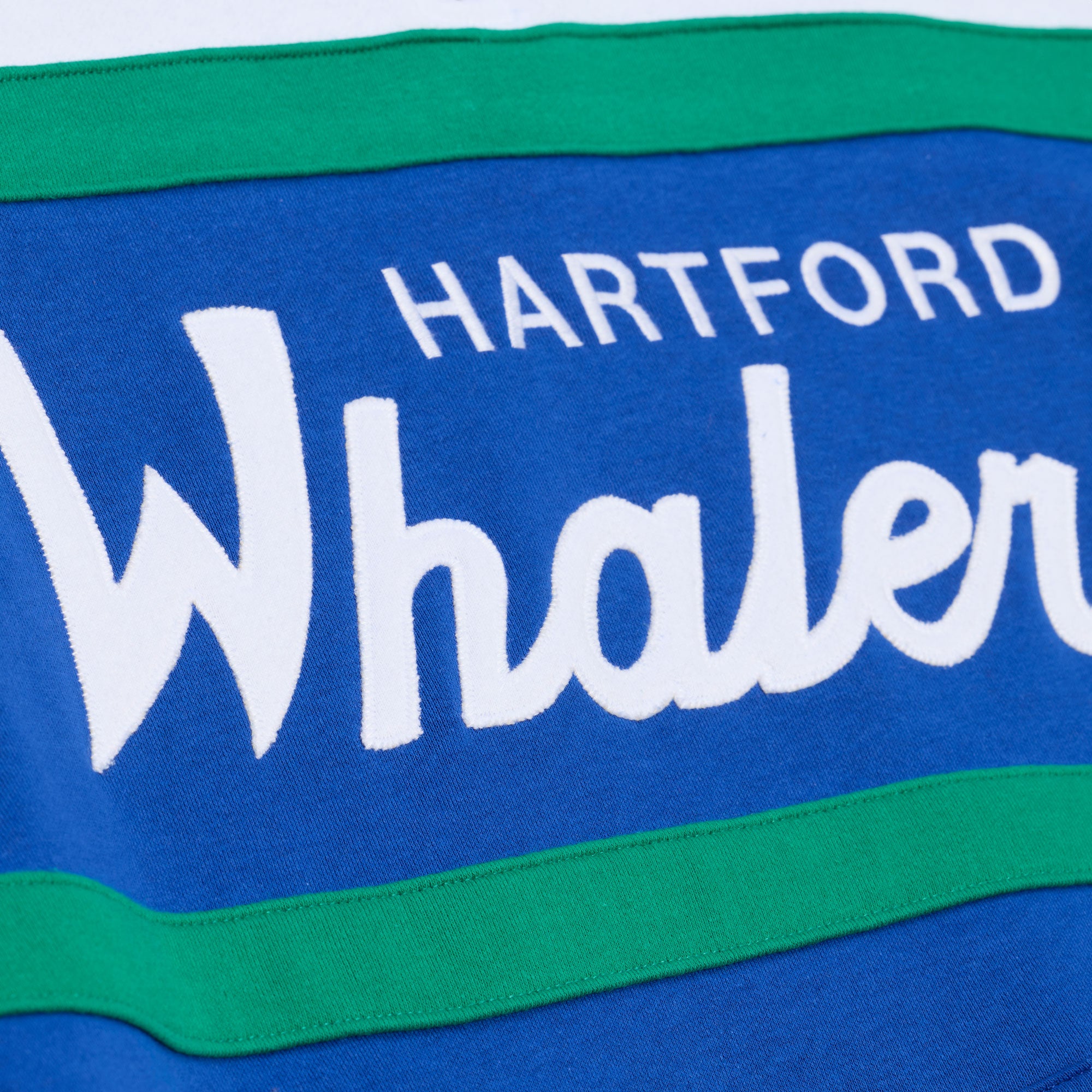 Close up of the "Hartford Whalers" wording in white across the front
