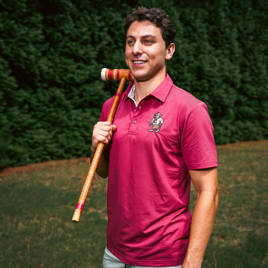 The polo being worn by a model outdoors
