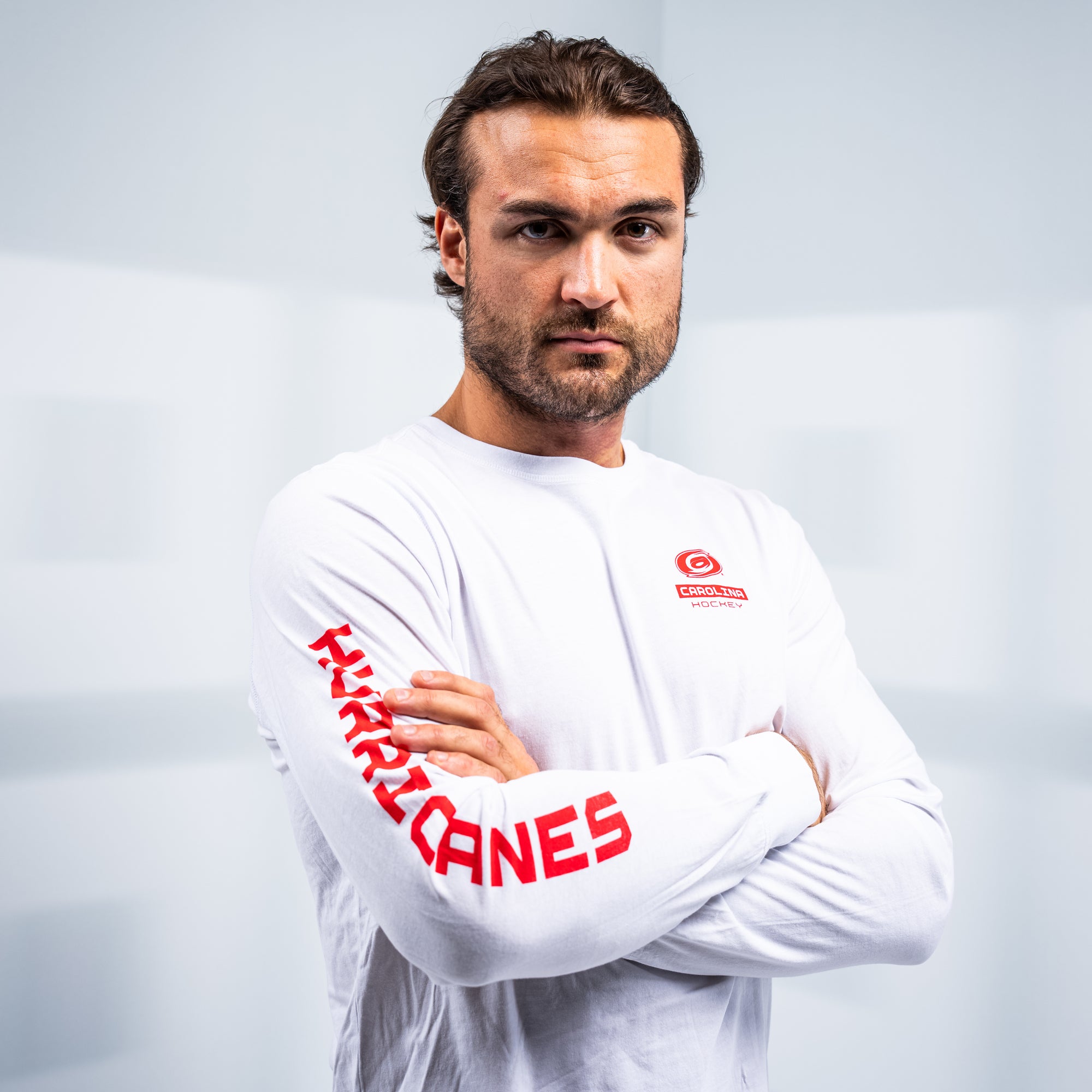 Hurricanes forward William Carrier posing with his arms crossed while wearing the shirt