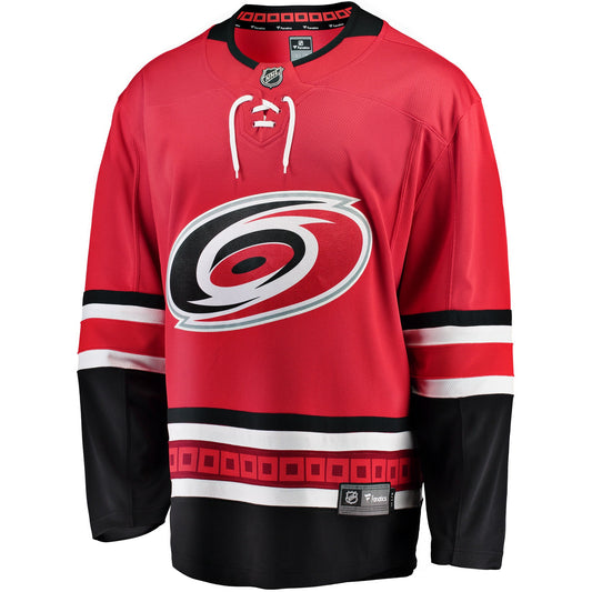 Front: red jersey with black and white trim, Primary logo on front, strings and NHL logo at neck