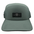 Green hat, black retangular patch on front with Whalers logo, "ESTD 1979"