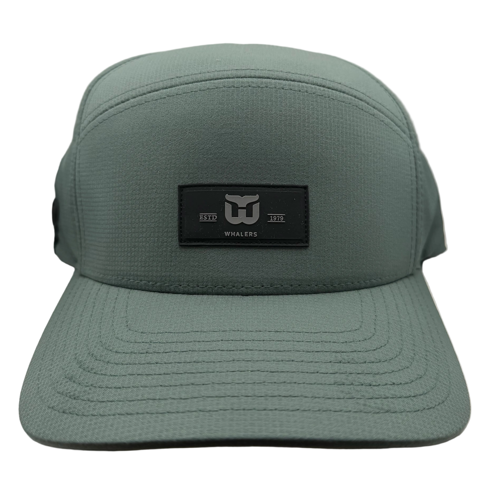 Green hat, black retangular patch on front with Whalers logo, "ESTD 1979"