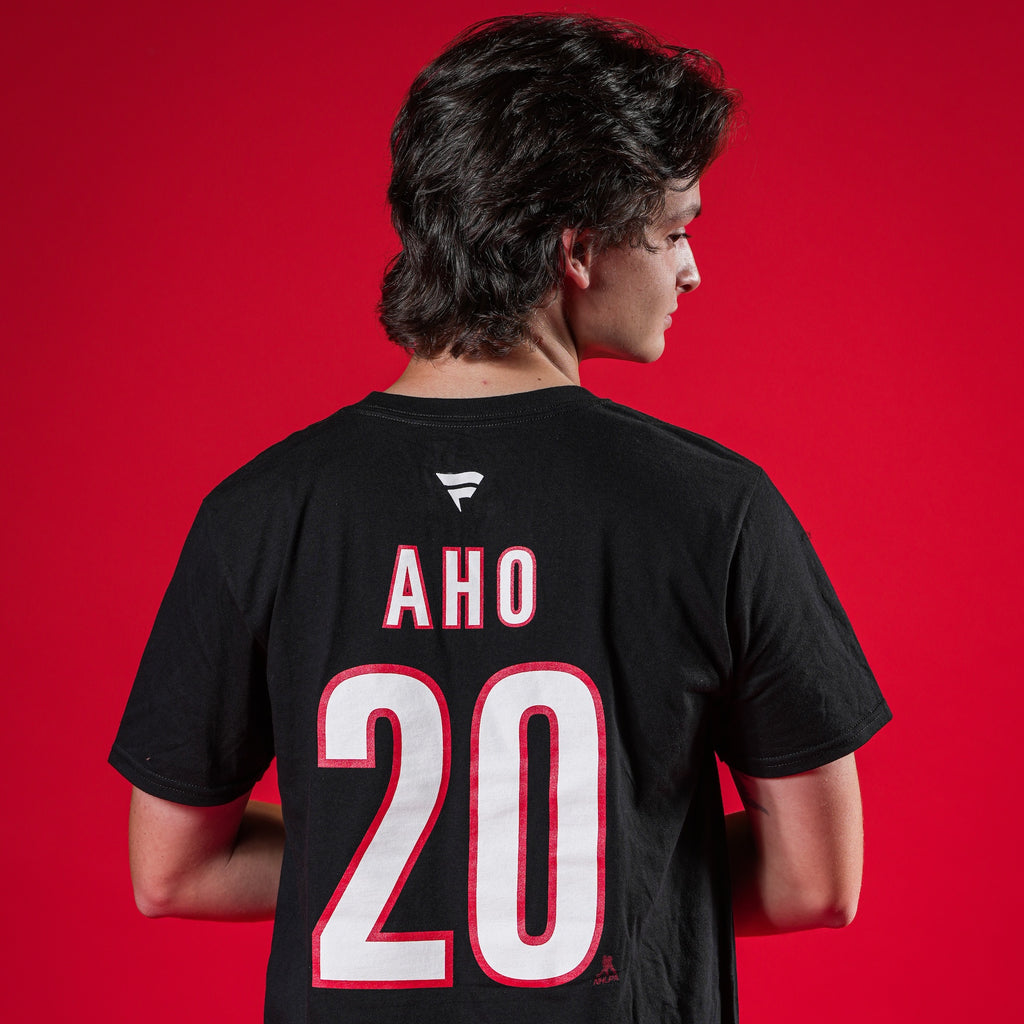 A model showcasing the back of the tee