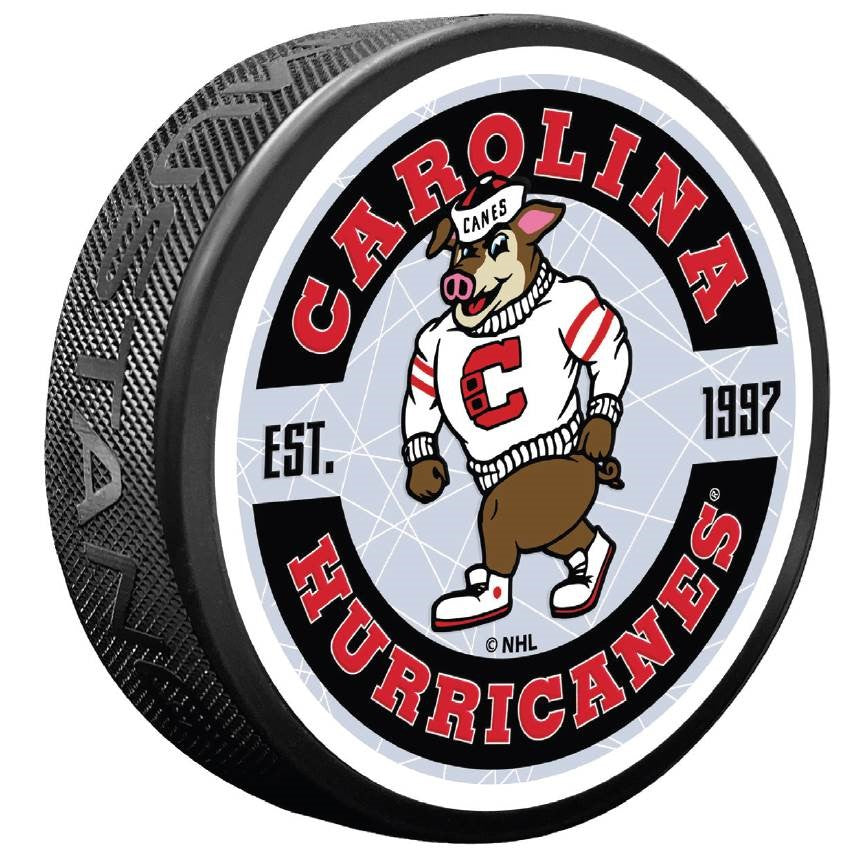 puck with Vintage Stormy graphic on top face, says Carolina Hurricanes Est. 1997