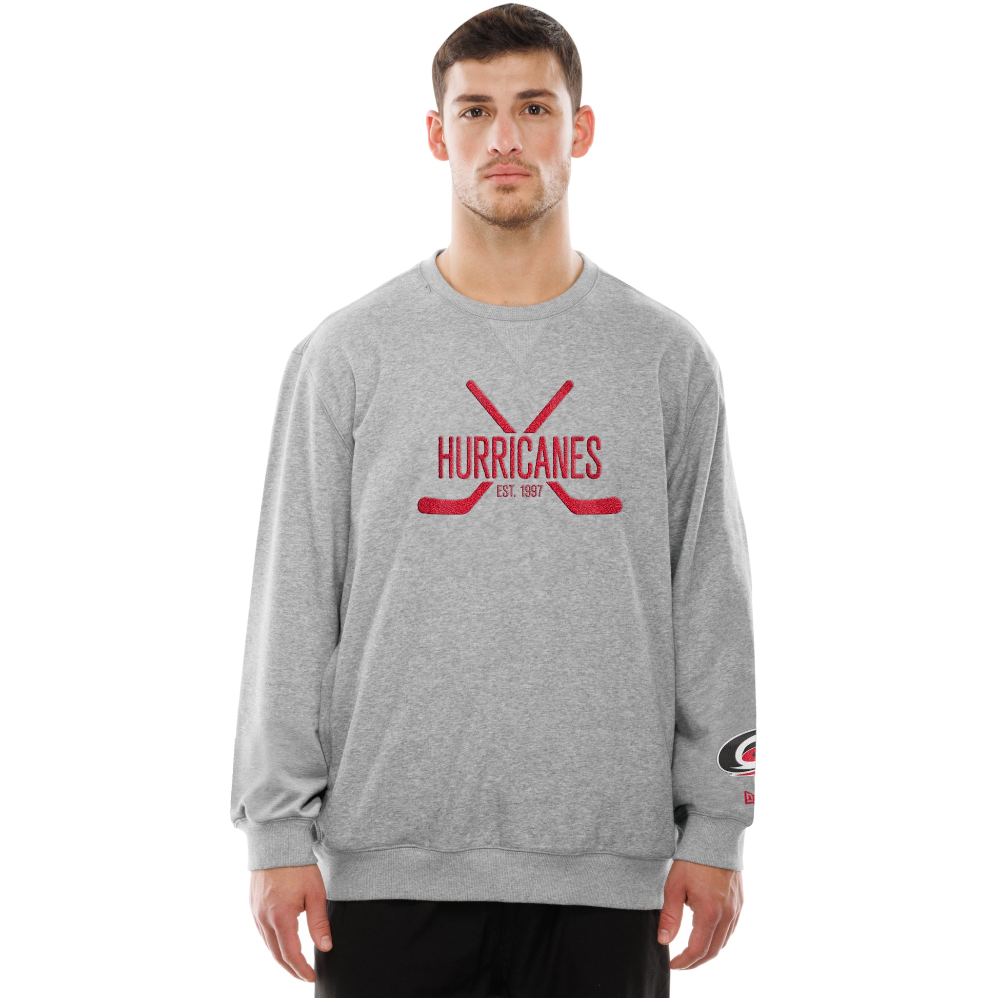 Front: Grey crewneck, "Hurricanes Est. 1997" in red with red crossed hockey sticks on front