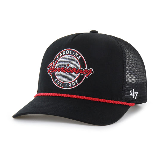 Front: Black trucker hat with red rope on brim, circular patch on front that says "Carolina Hurricanes Est. 1997"