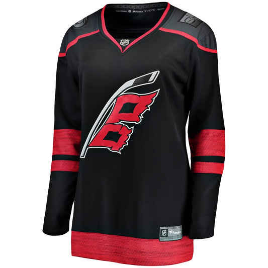 Front: black jersey with dark gray shoulders and red trim, Flags logo on front