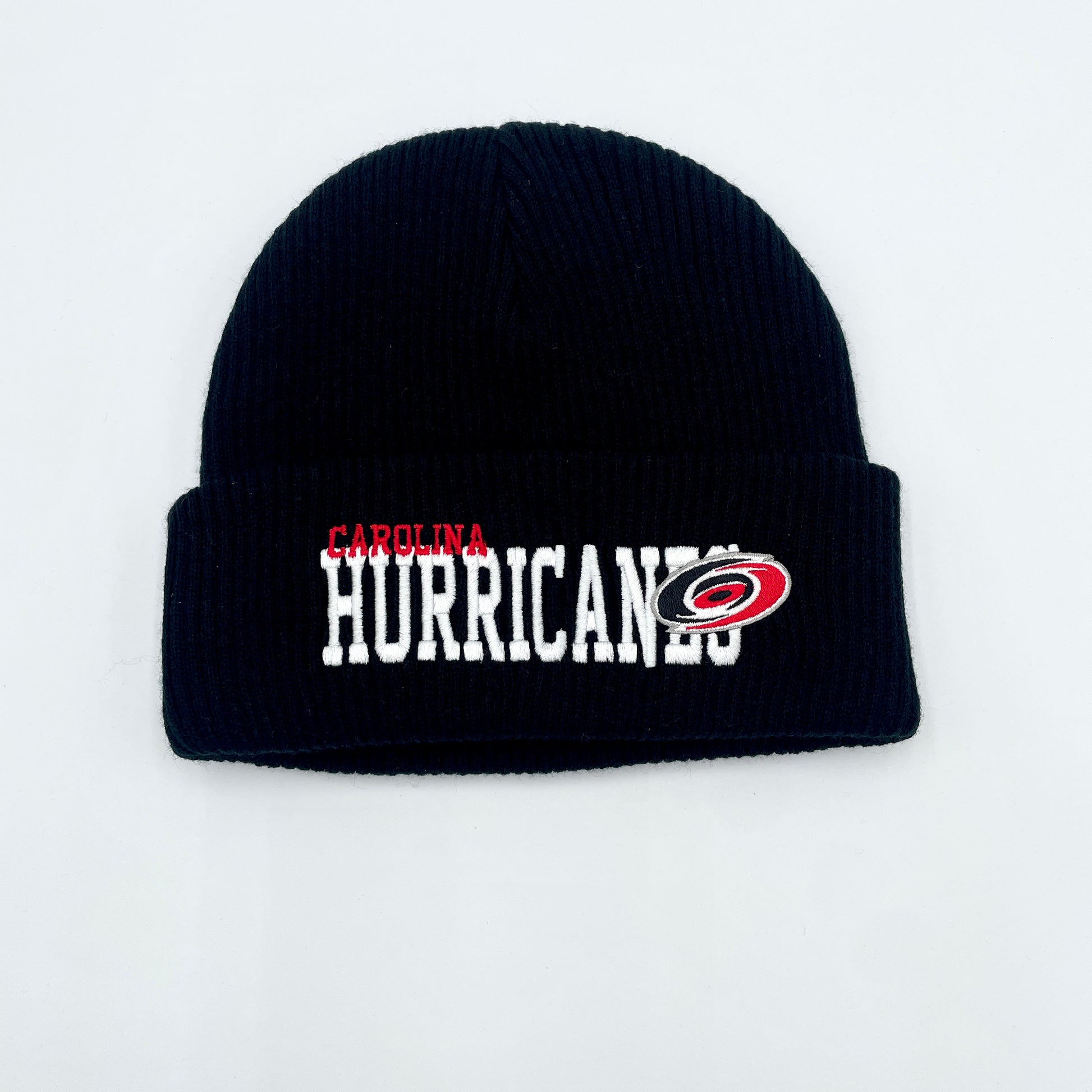 Front: Black cuffed knit, says Carolina in red Hurricanes in white with primary logo on cuff