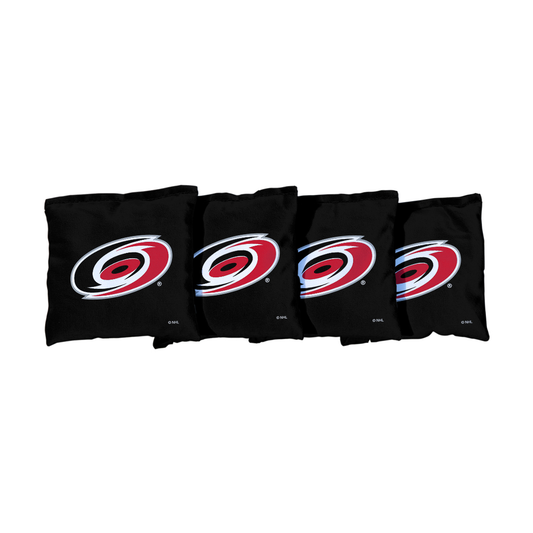 4 black cornhole bags with Hurricanes primary logo