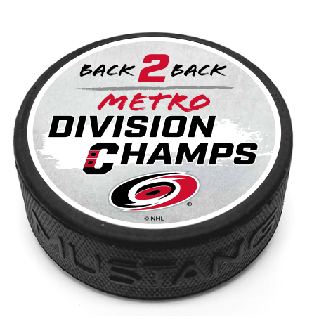 puck with gray top that says Back 2 Back Metro Division Champs with primary logo