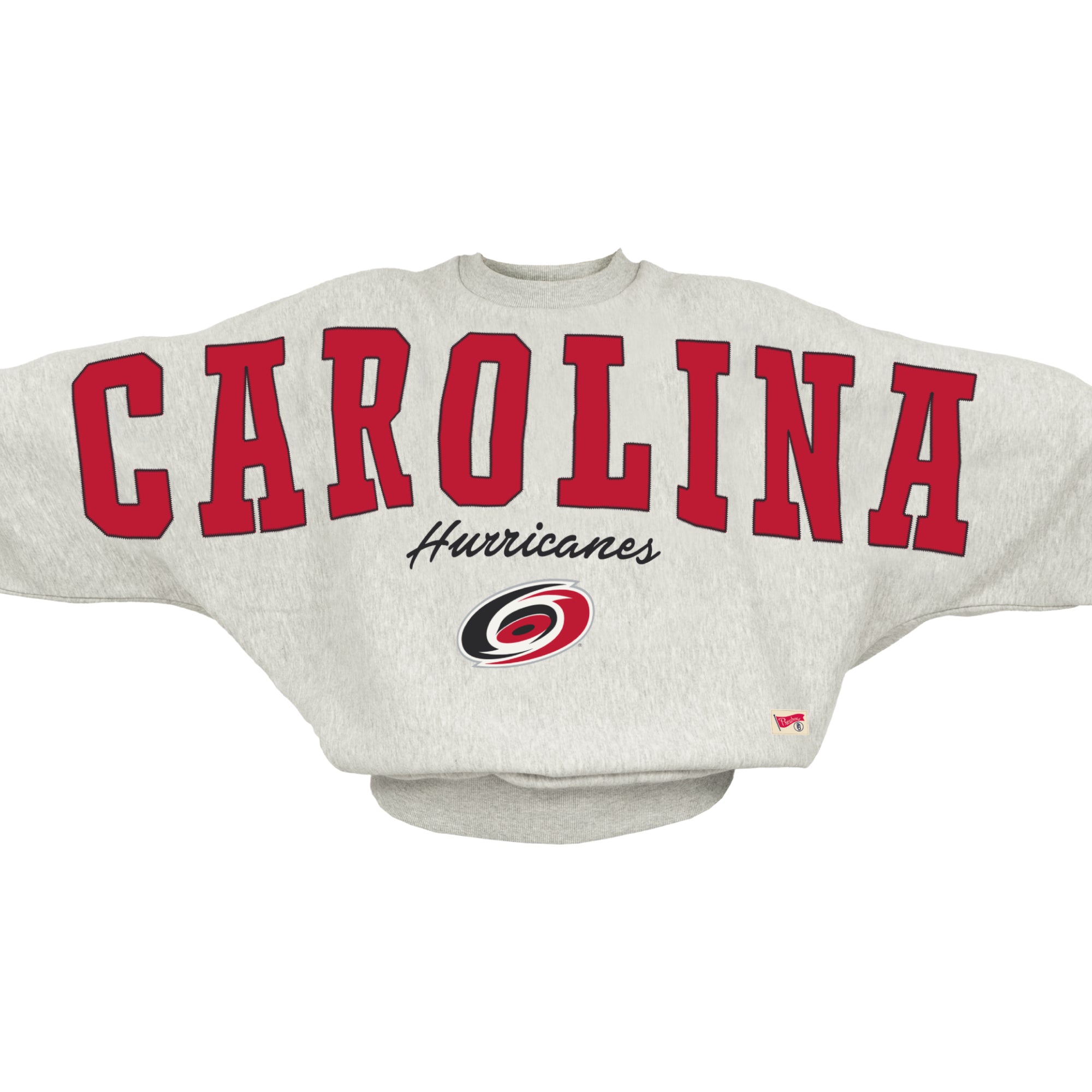 Grey sweater, "CAROLINA" in red across chest/arms, "Hurricanes" in black beneath with Primary logo