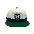 White/blue corduroy hat with green brim, Whalers logo on front