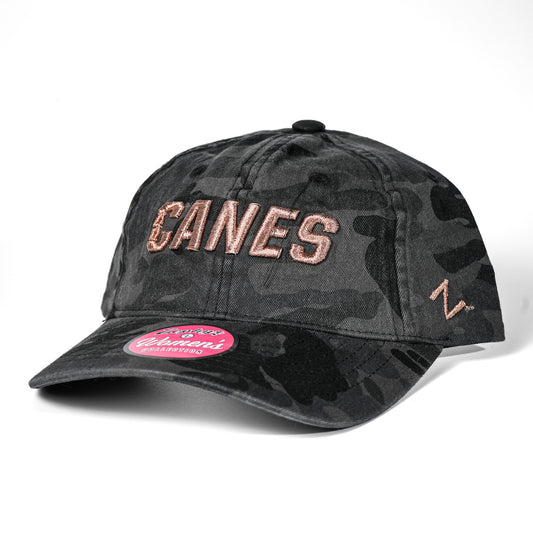 Front View: Cap, Dark Grey Camo with Rose Gold Canes Wordmark, zephyr logo on side 