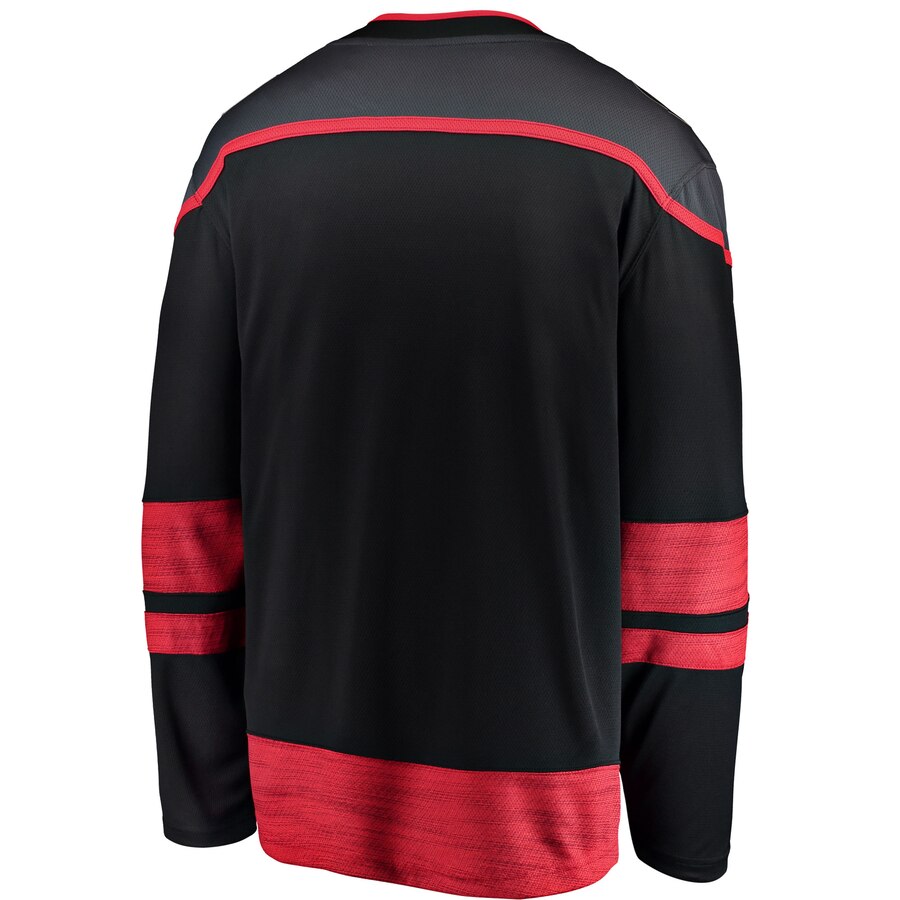 Back View: Black jersey with grey shoulders and red stripes on sleeves and at bottom