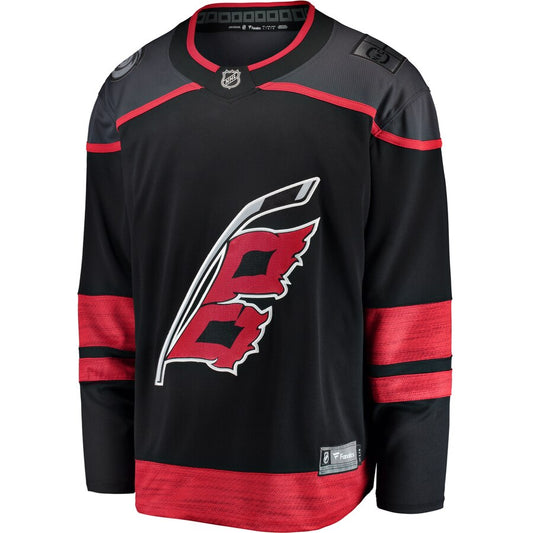 Front View: Black jersey with grey shoulders and Hurricanes flag logo and red stripes on sleeves 