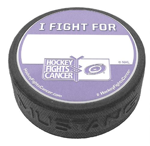 Hockey puck with the Hurricanes Hockey Fights Cancer logo with the phrase "I Fight For" with a blank white space for personal writing on a purple and white top face.