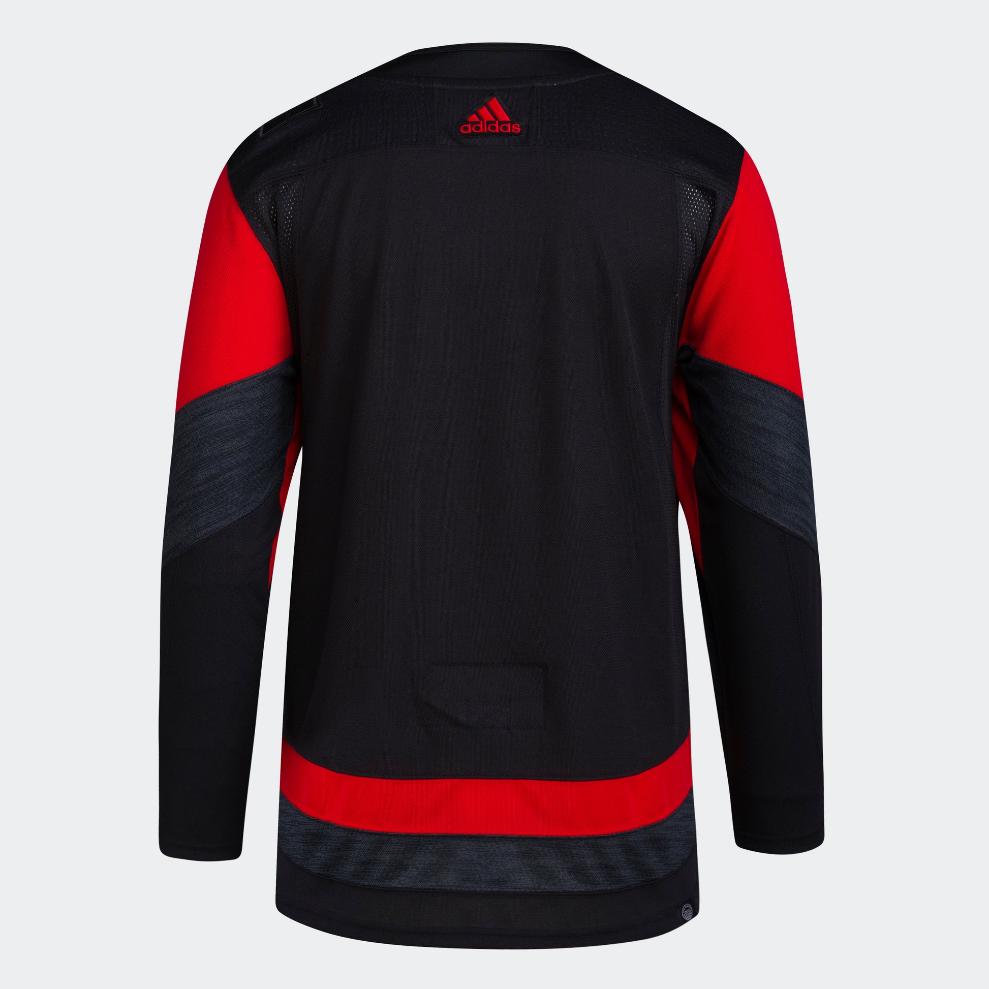 Back View: Black and red jersey with red adidas logo at top.